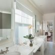 PAIRFUM natural reed diffuser on the marble top of in a classically English but luxurious bathroom