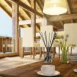 PAIRFUM luxury, natural reed diffuser on a coffee table in an open plan kitchen & living room