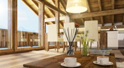 PAIRFUM luxury, natural reed diffuser on a coffee table in an open plan kitchen & living room