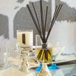 PAIRFUM luxury scented candle and reed diffuser on a dining table