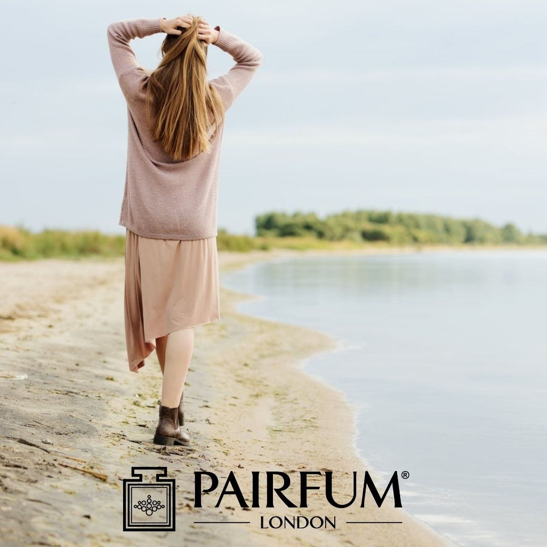 Woman Walking On A Beach