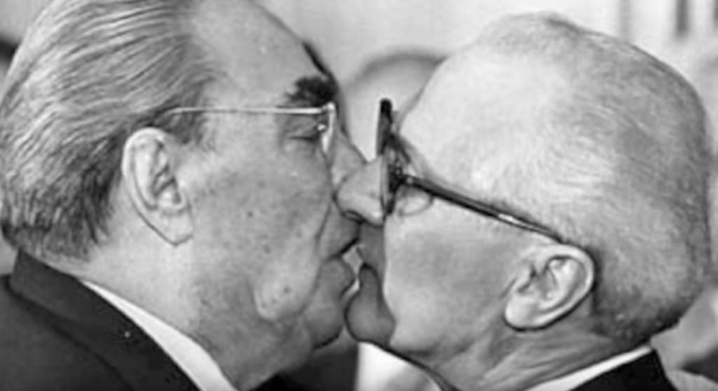 Soviet Leader Leonid Brezhnev And East German President Erich Honecker Share A Socialist Fraternal Kiss
