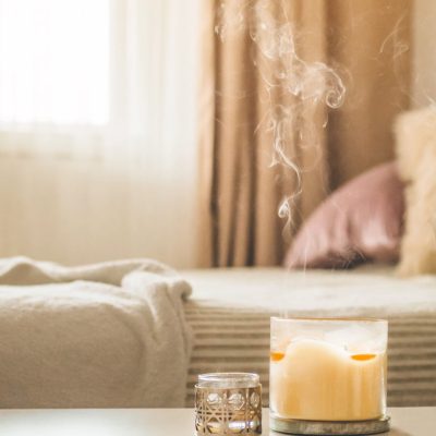 Benefits of scented candles, aromatic candle in a bedroom.